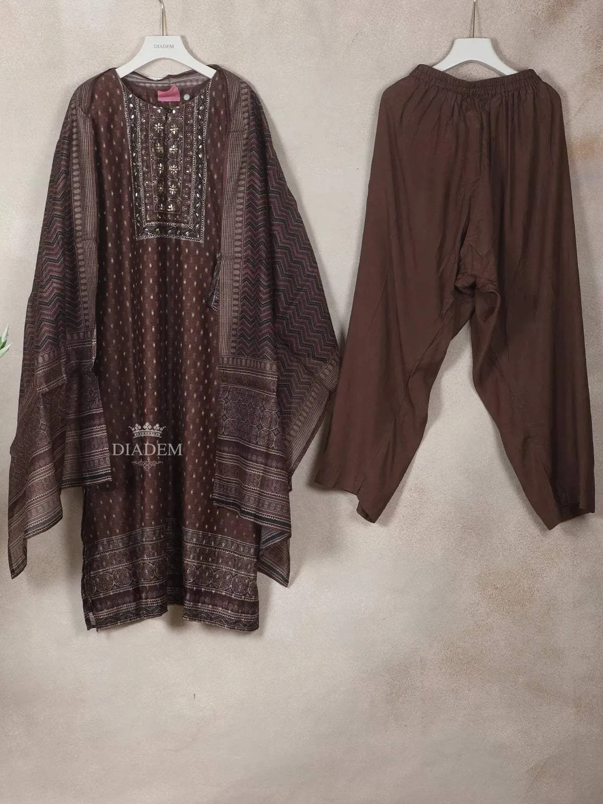 Dark Brown Georgette Straight-Cut Salwar Suit Adorned with Floral Design, Paired with Dupatta