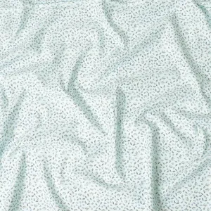 Light vista green blended cotton shirting fabric with blue and black print in leaf design-D9633