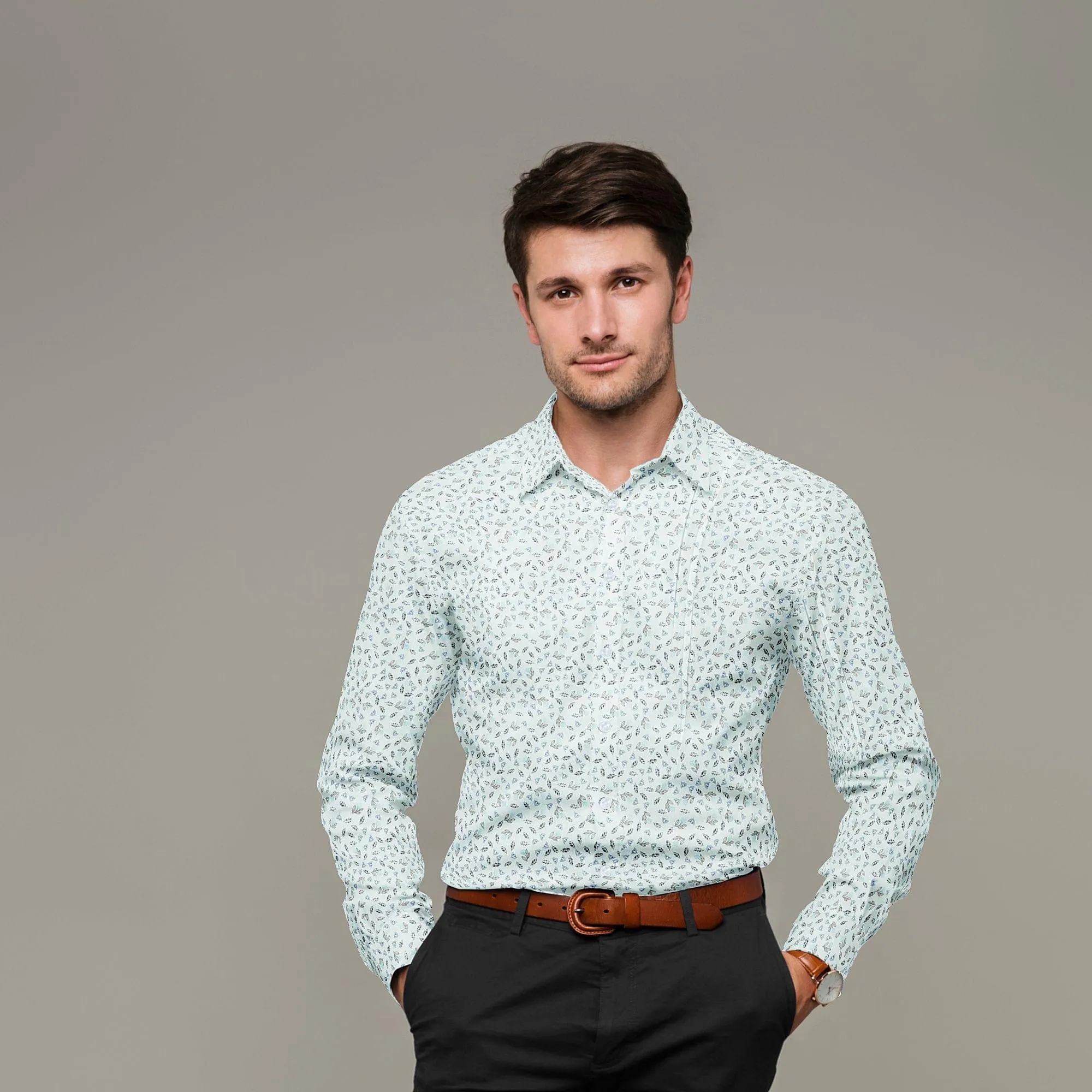 Light vista green blended cotton shirting fabric with blue and black print in leaf design-D9633