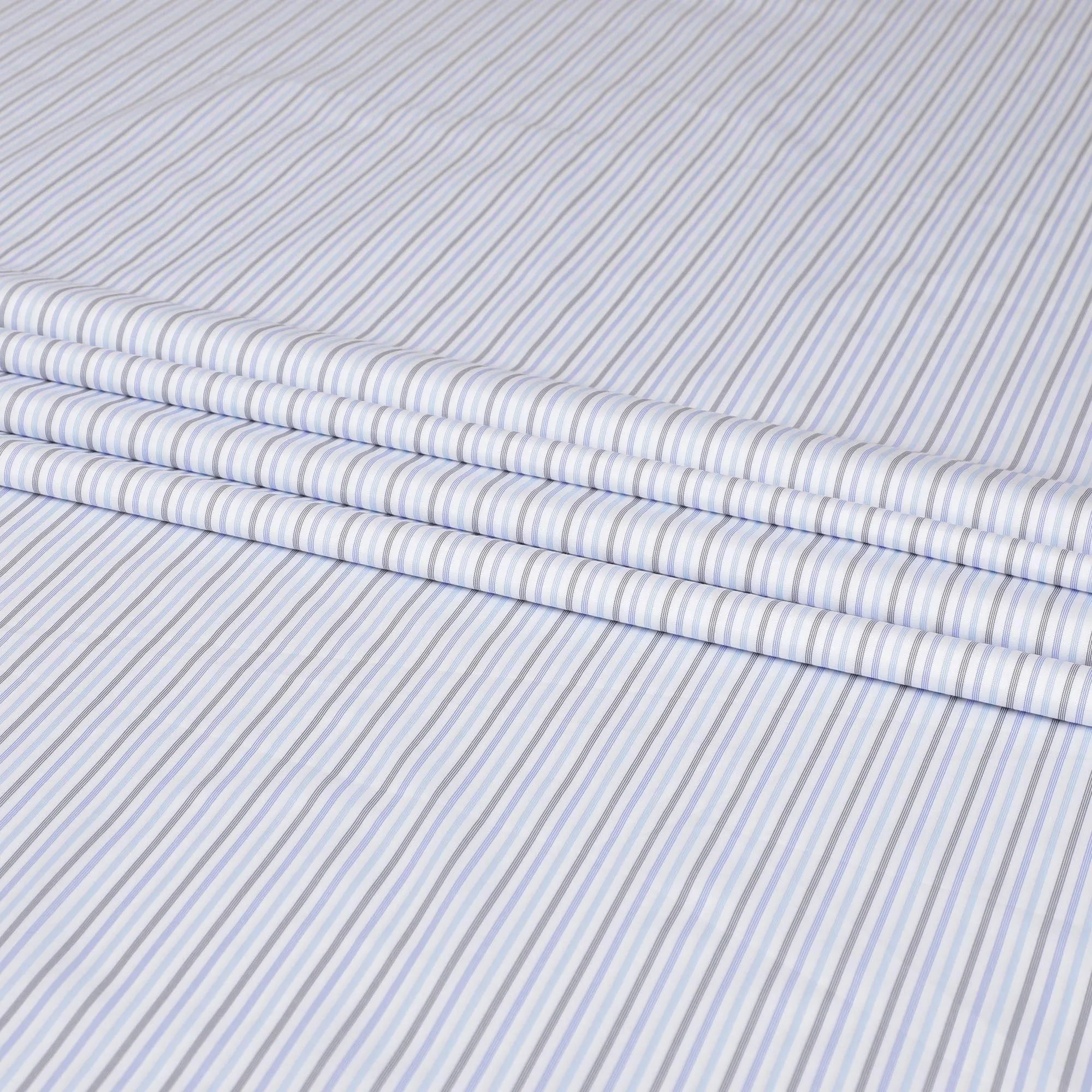 White blended Cotton shirting fabric with black, blue and baby blue print in stripe design-D6354